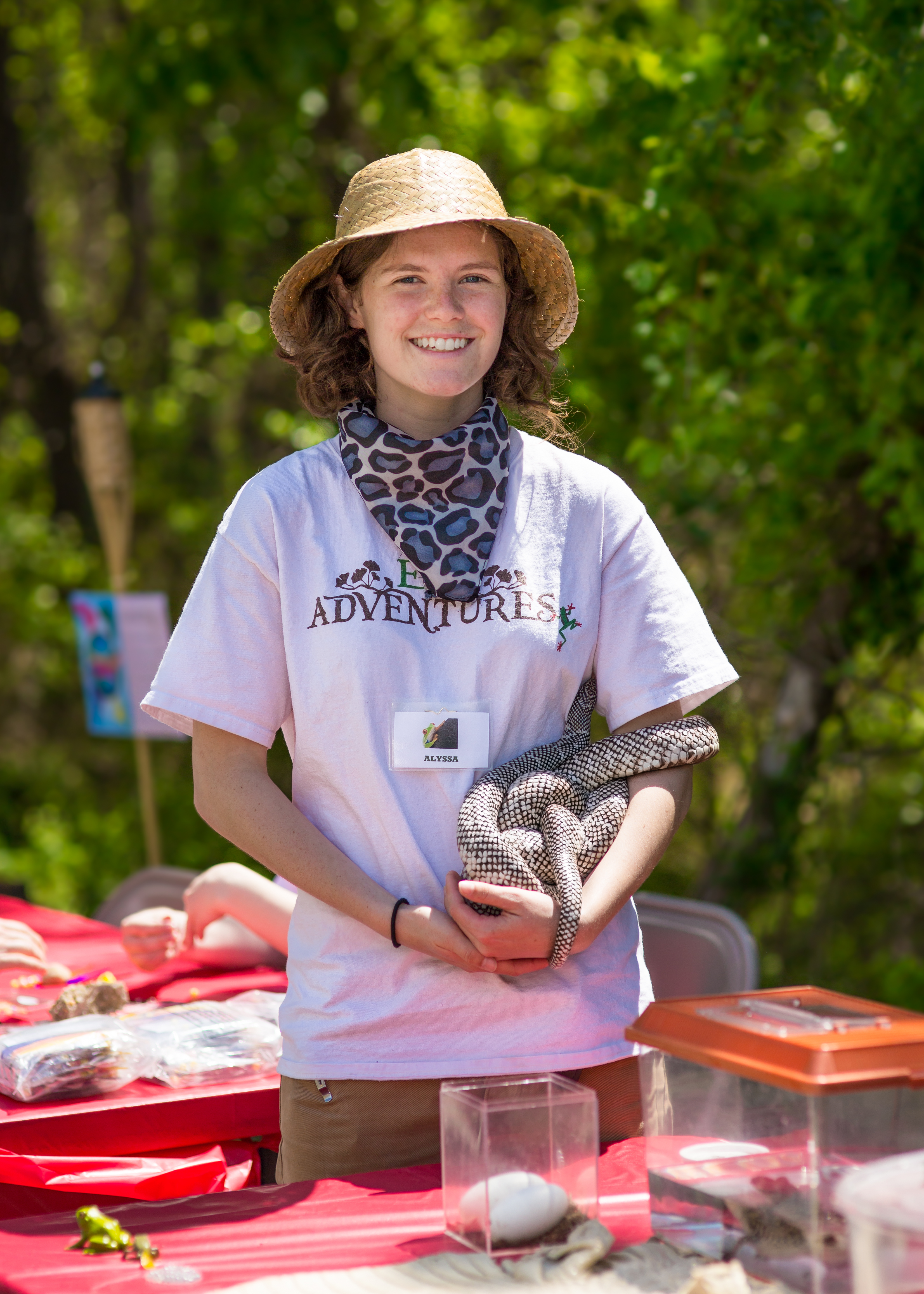 A woman holding an animal in her hands.