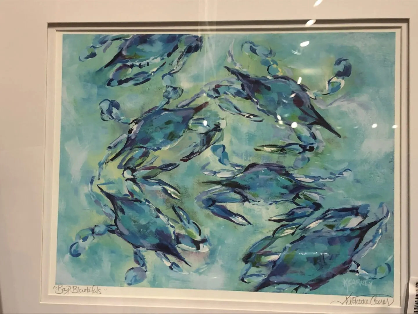 A painting of blue crabs swimming in the water.