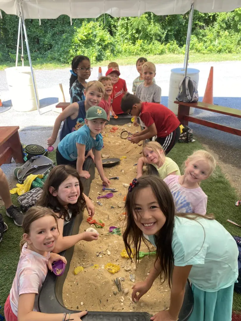 A group of children sitting around a table.