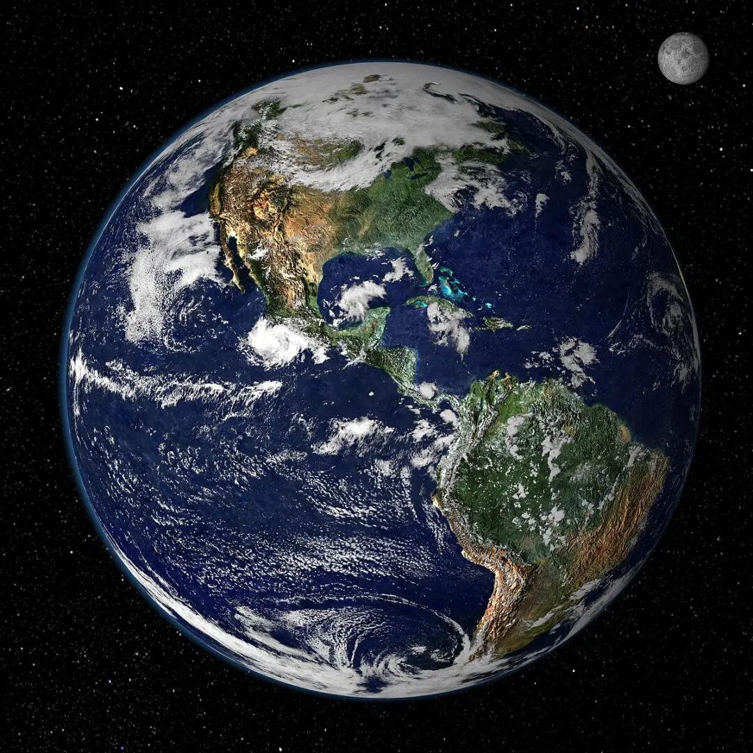 A picture of the earth and moon taken from space.